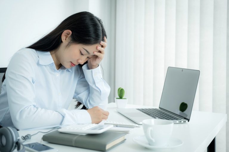 Woman frustrated with and not happy at work