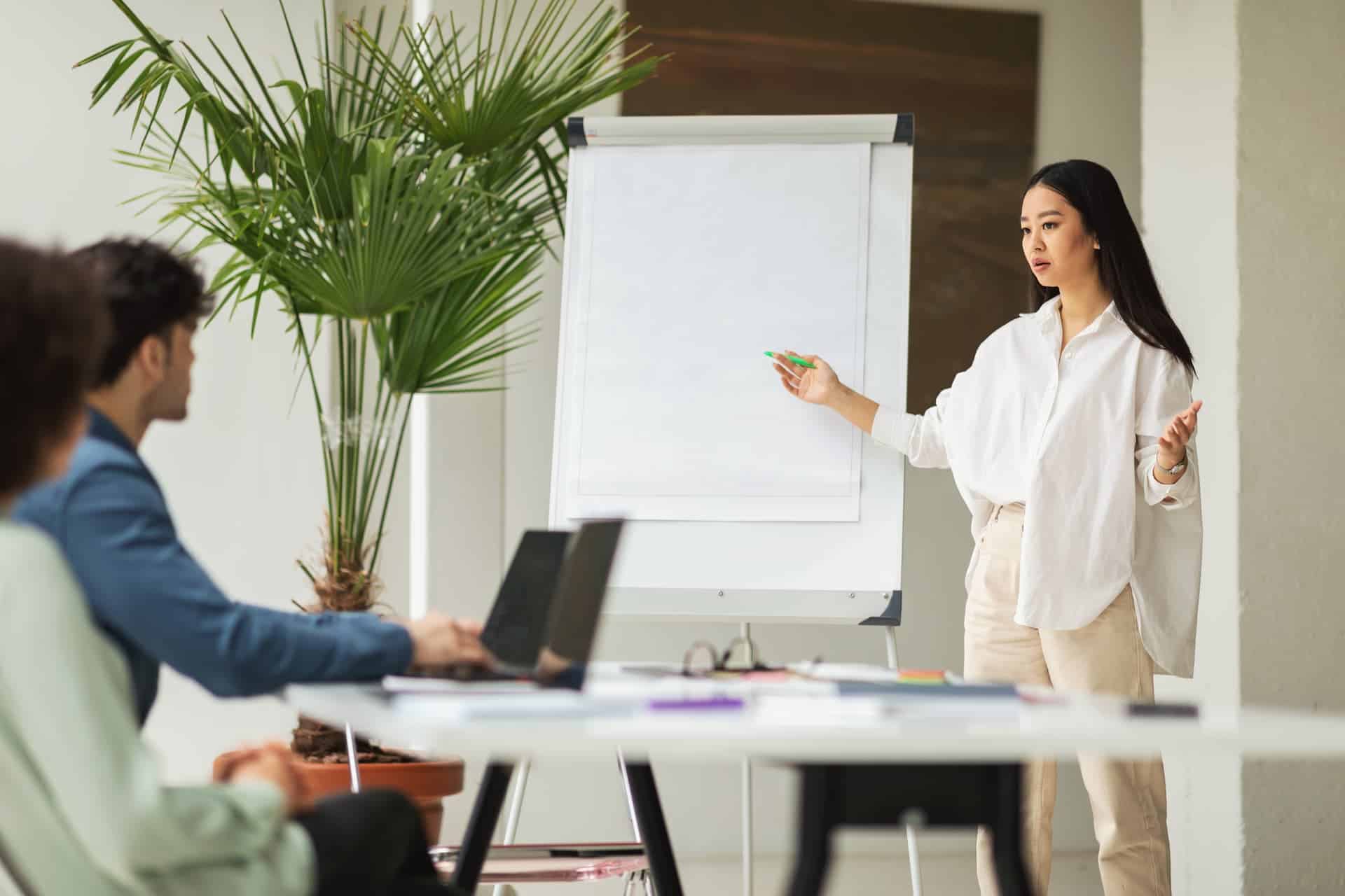 Woman presenting an idea to her team through engaging storytelling.
