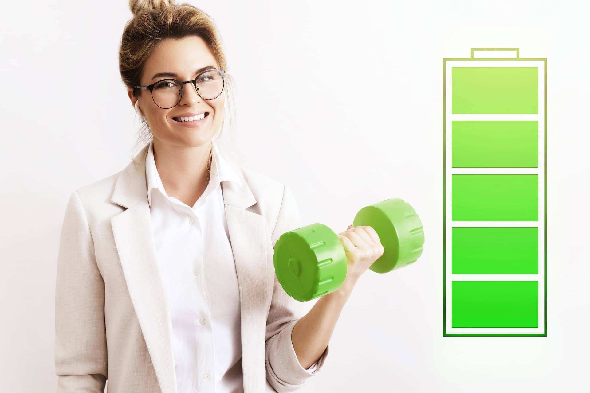 Woman in work attire holding a dumbbell, and a energy bar showing her battery is full.