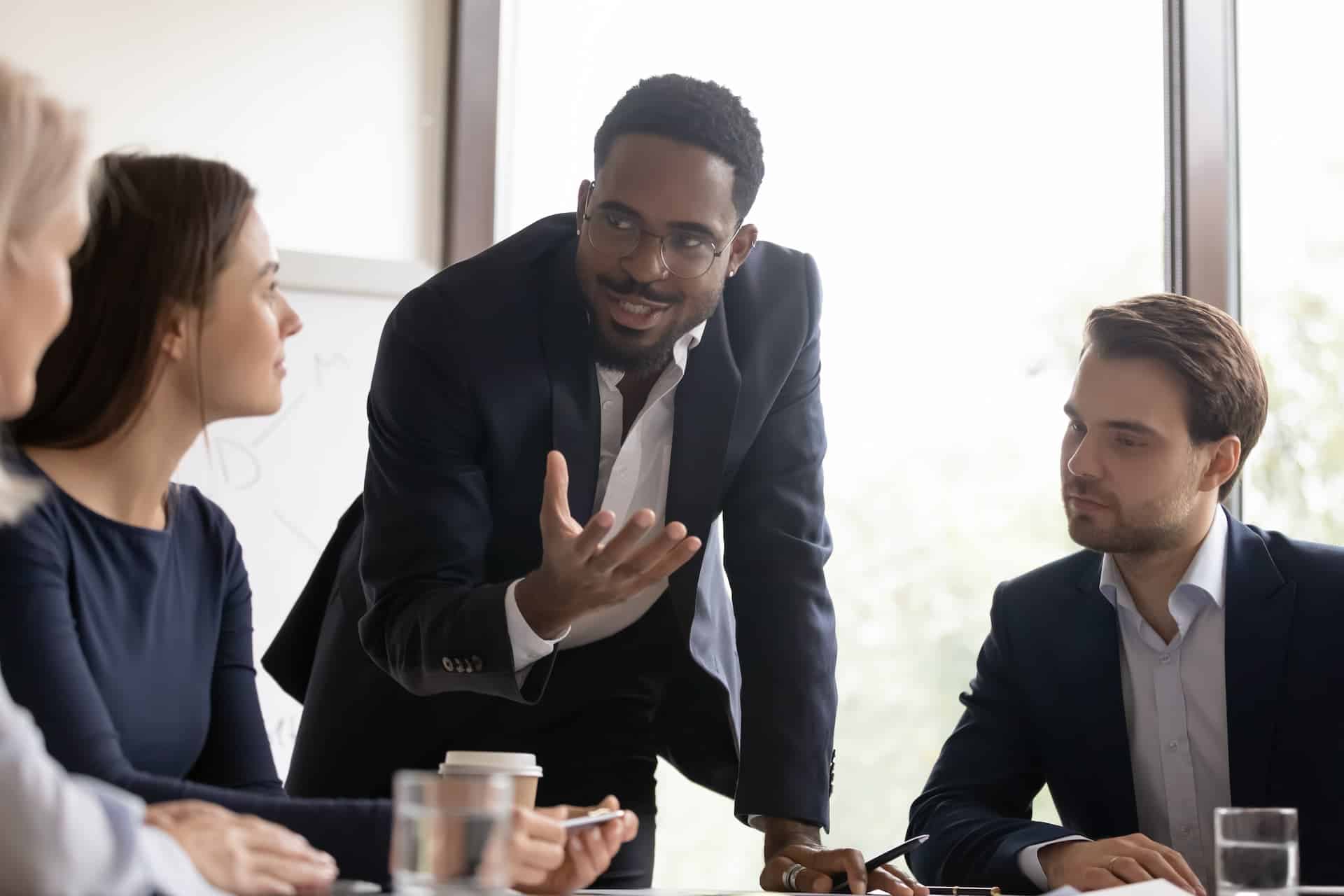 Man convincing his coworkers.
