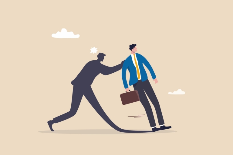 An illustration of a man's shadow pushing himself as he wears a suit and holds a briefcase, denoting the idea of being courageous in the workplace or your career development.