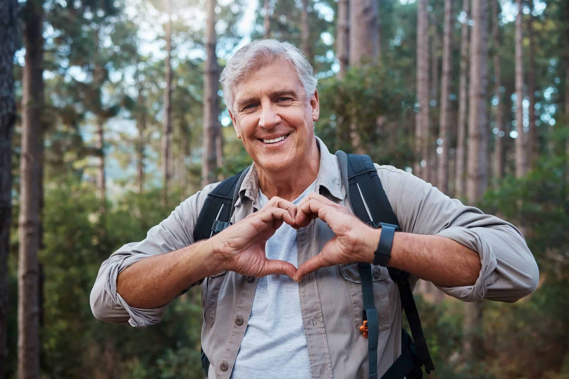 Man taking a hike as a way to destress and care for himself. 