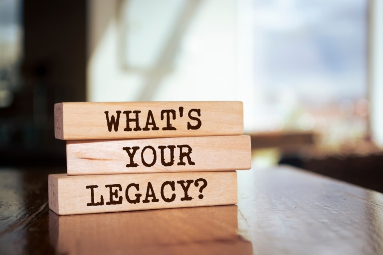 Wooden tiles that spell out, 'What's your legacy?', prompting reflection on the lasting impact and contributions one leaves in one's career.