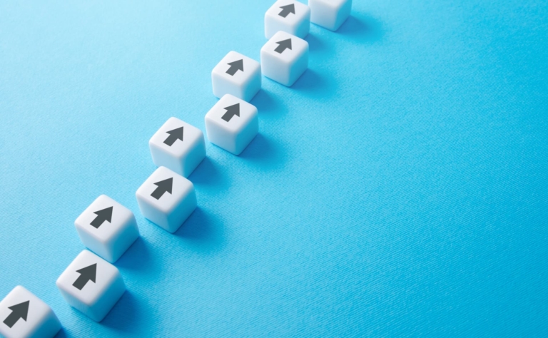 Diced arrows arranged in a forward direction, symbolizing the importance of consistency in step-by-step progress.
