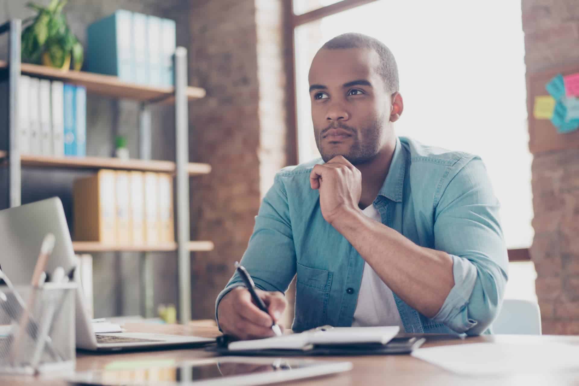 A man reviewing a list of pros and cons, demonstrating careful judgment in decision-making.