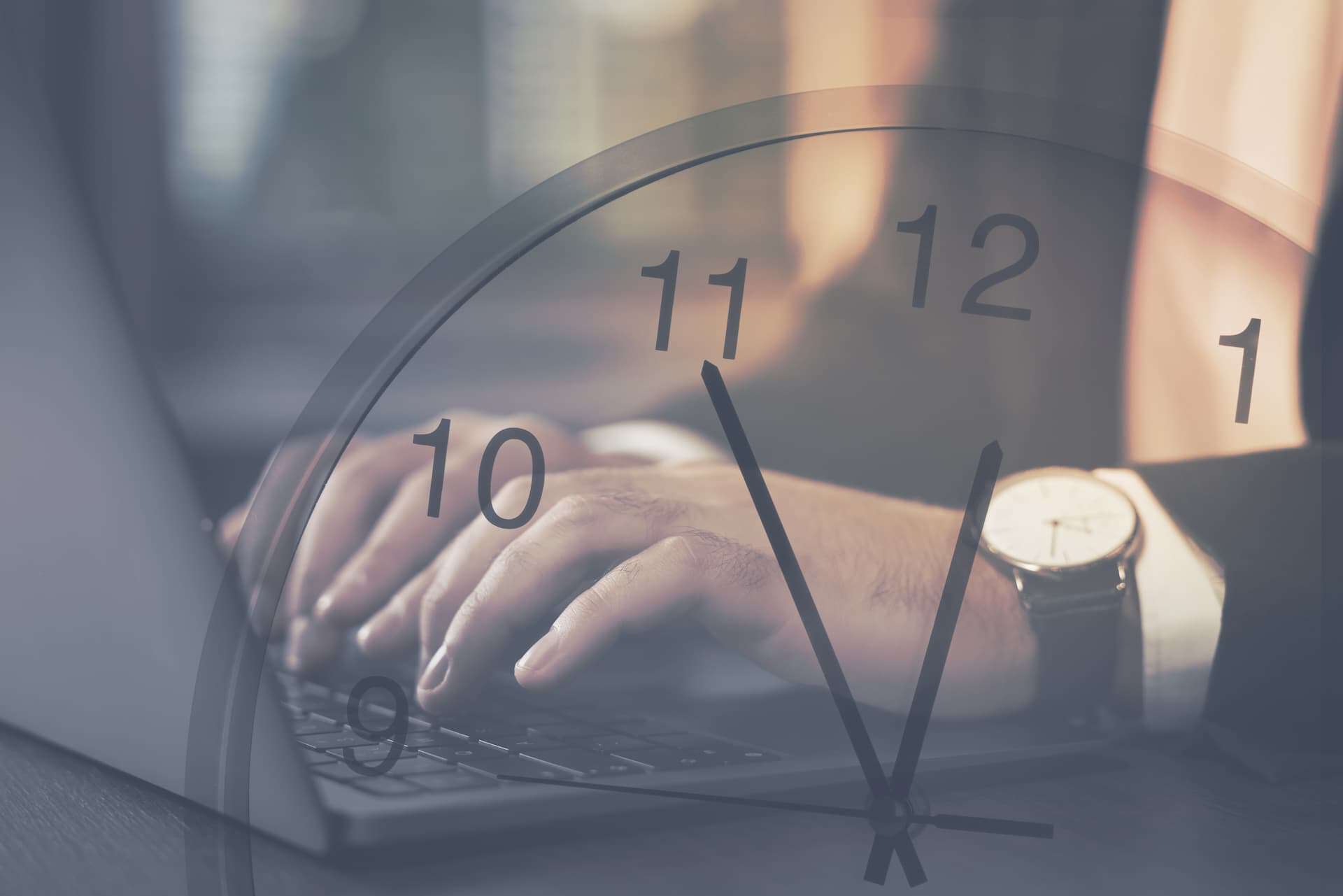A man's hand typing on a laptop with a transparent clock overlay, symbolizing the value of consistent routines.