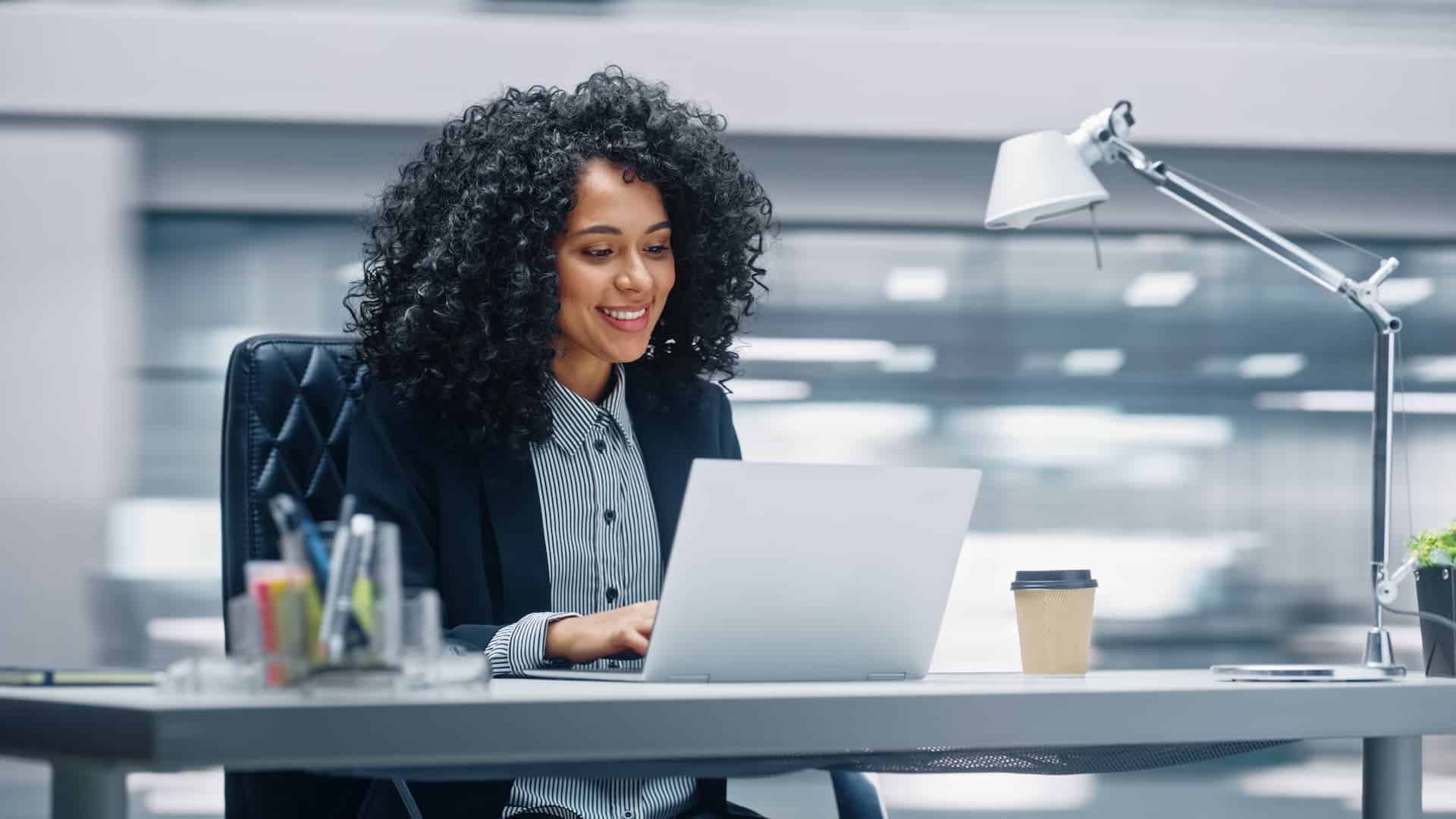 A woman deeply concentrated on her work, illustrating the focus needed for deep work and high productivity.