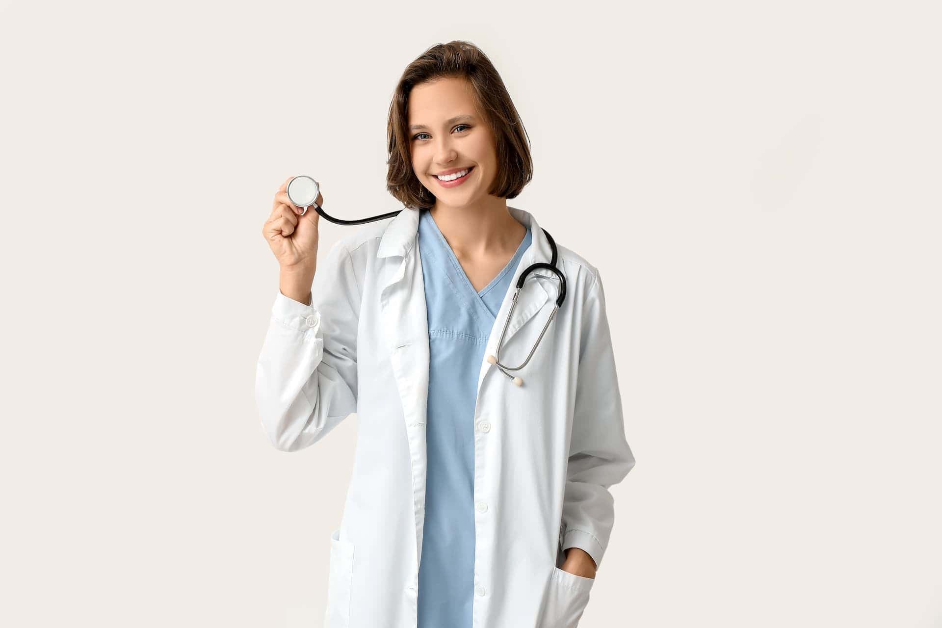 Smiling female doctor holding a stethoscope, symbolizing a career health checkup.