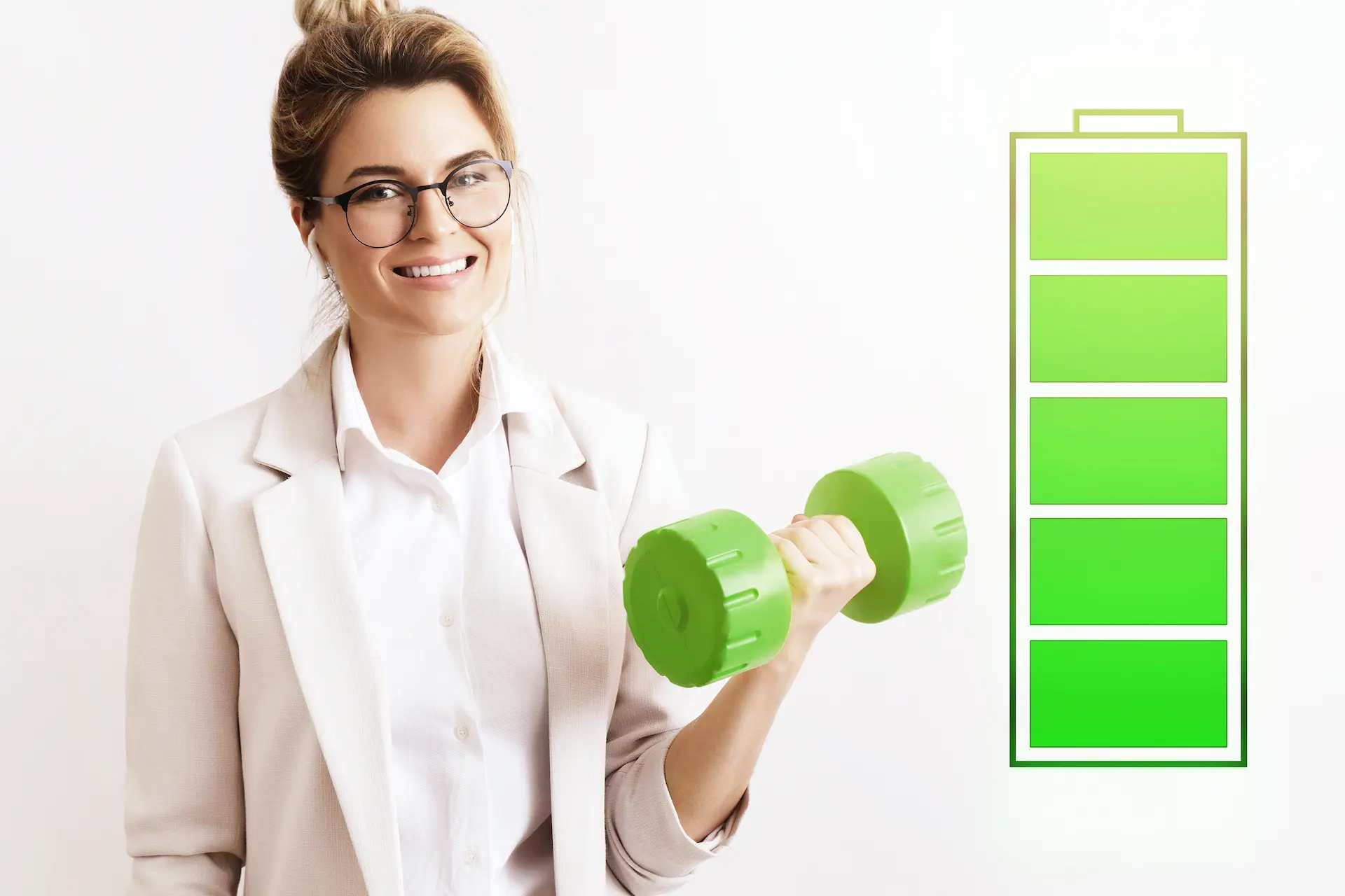 A smiling businesswoman lifts a green dumbbell beside a full battery icon, symbolizing the power of energy management for success.