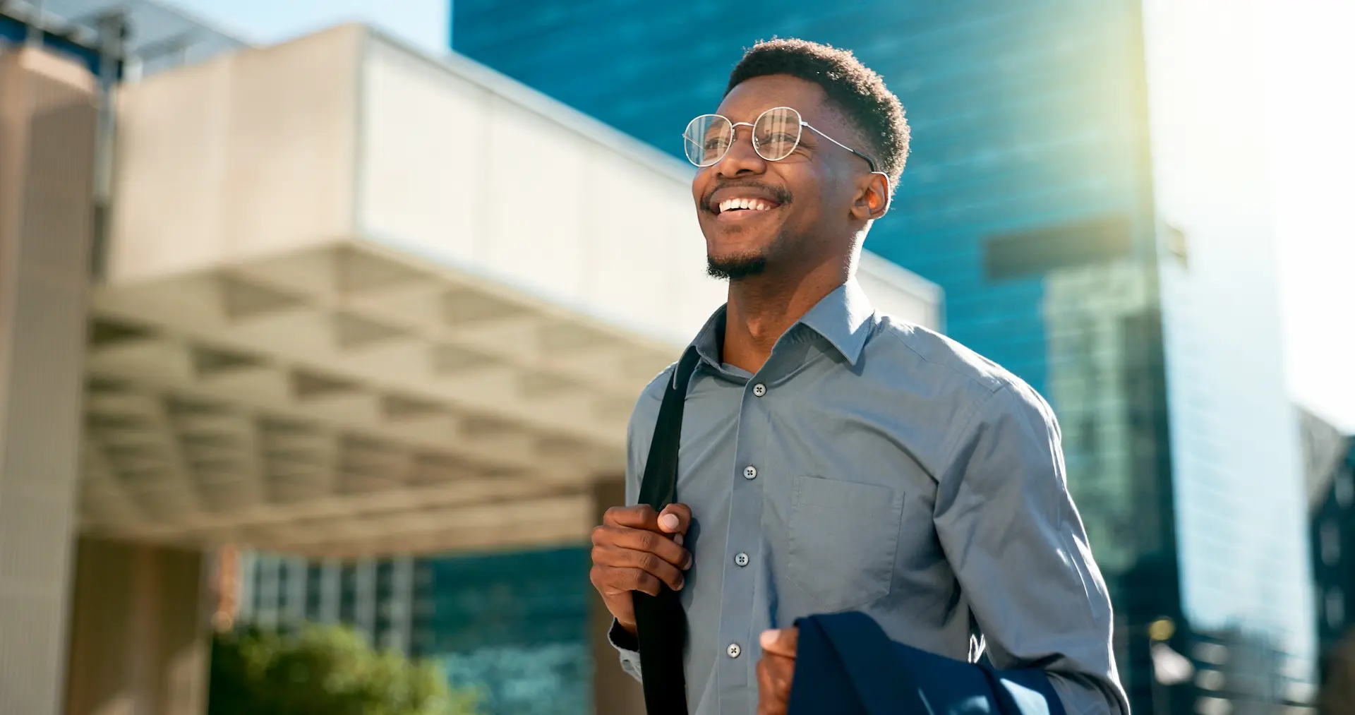 A man walks confidently toward work, embodying a proactive mindset and readiness to navigate career opportunities.