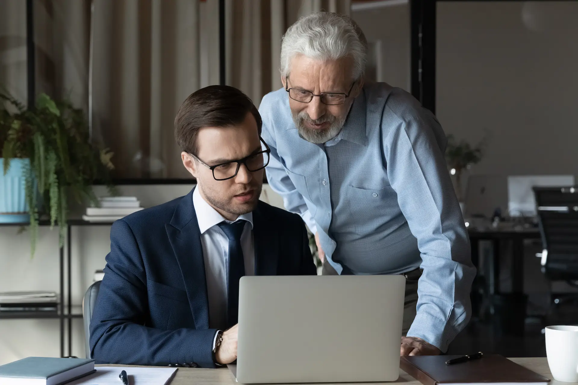 A manager guiding a team member in his career growth, helping him choose his career path.