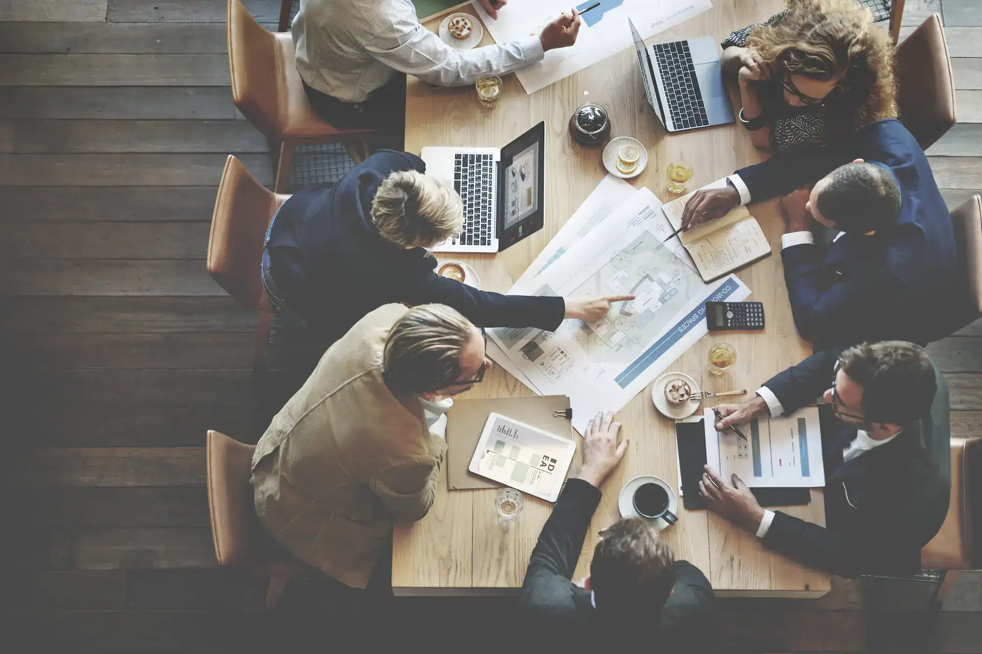 A team conducts a capability audit in a meeting, discussing organizational strengths and areas for improvement.