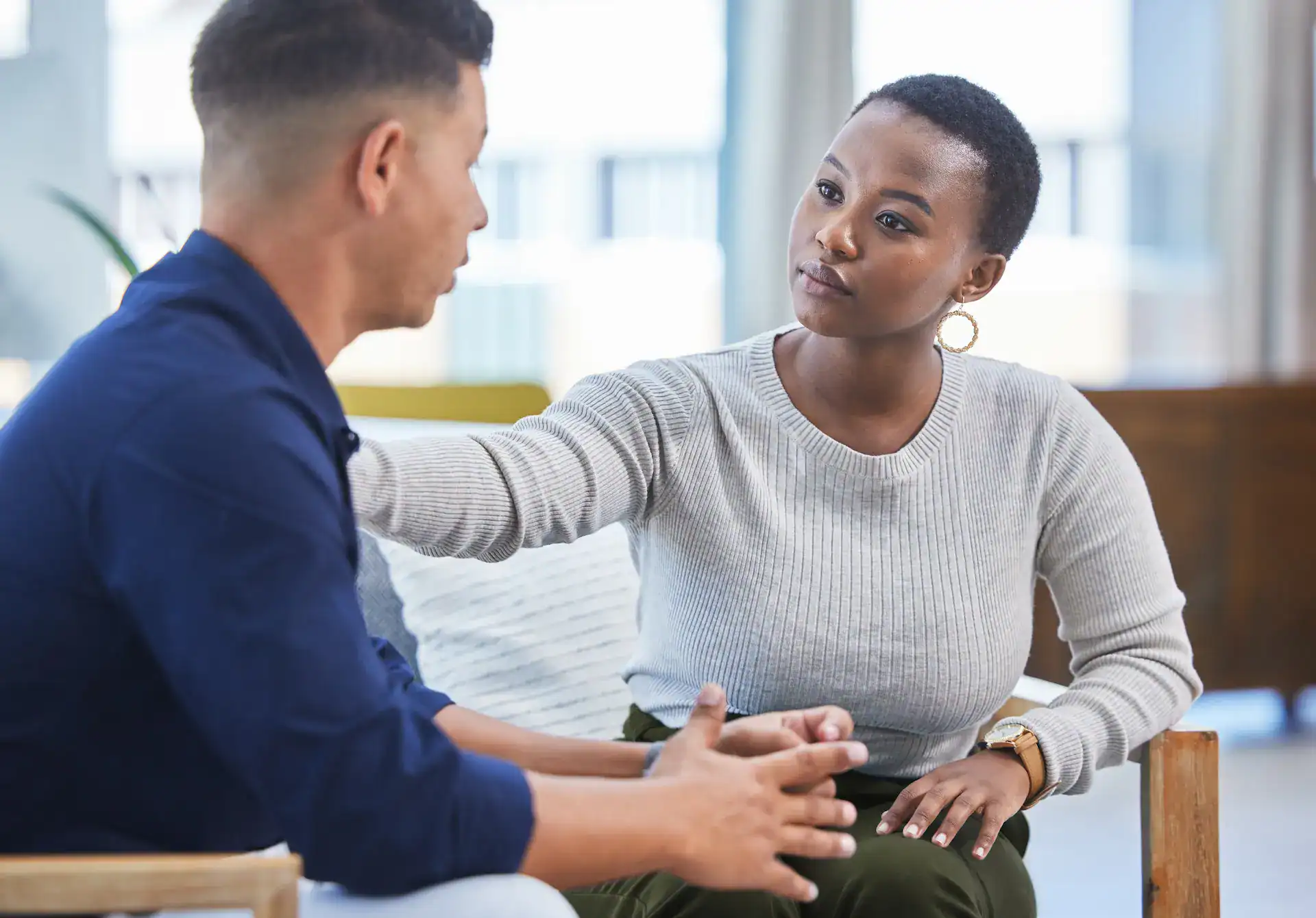 A woman and a man talking about his inner critics.