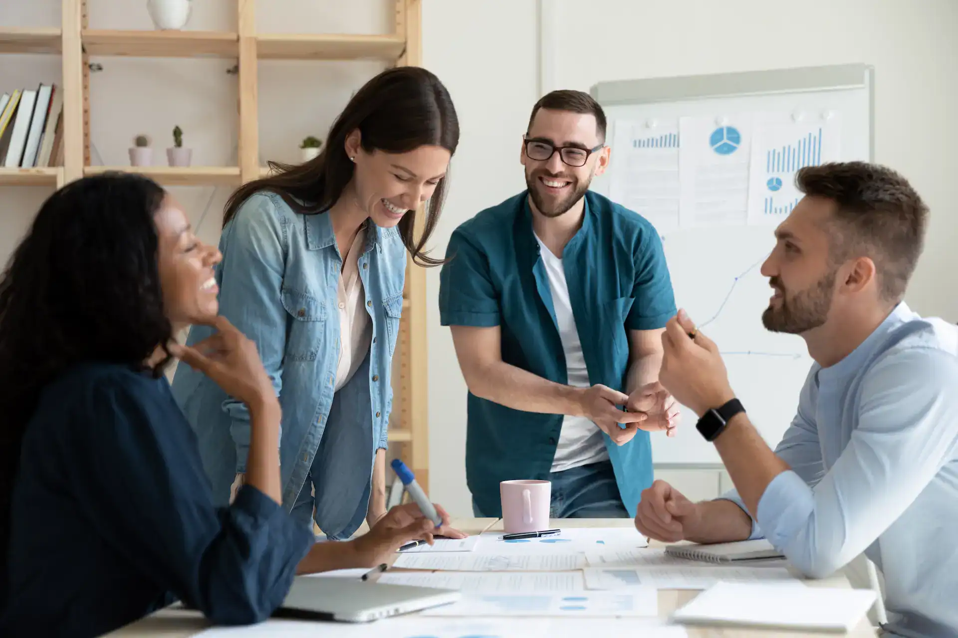 A management team collaborates enthusiastically during a productive meeting.