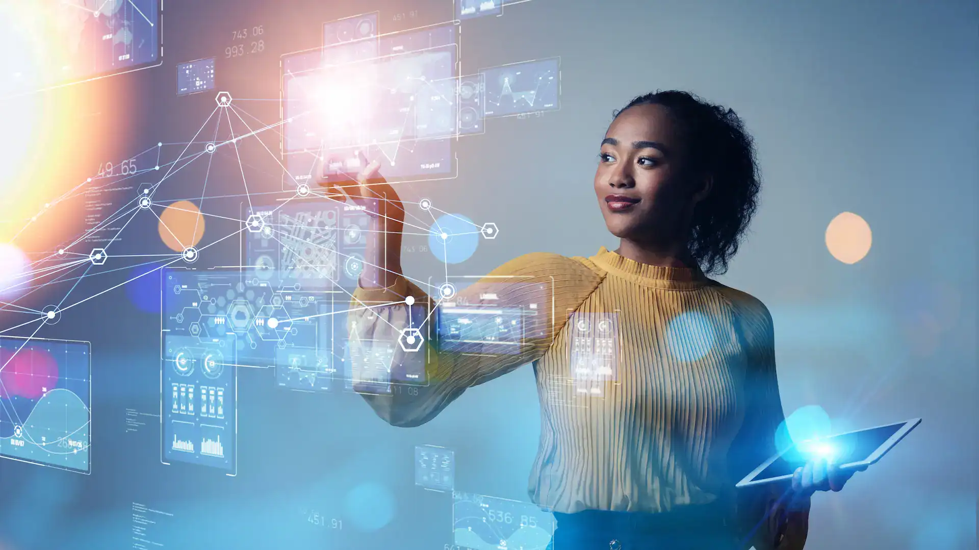 A woman surrounded by holographic interfaces or holographic projections denoting the future of work
