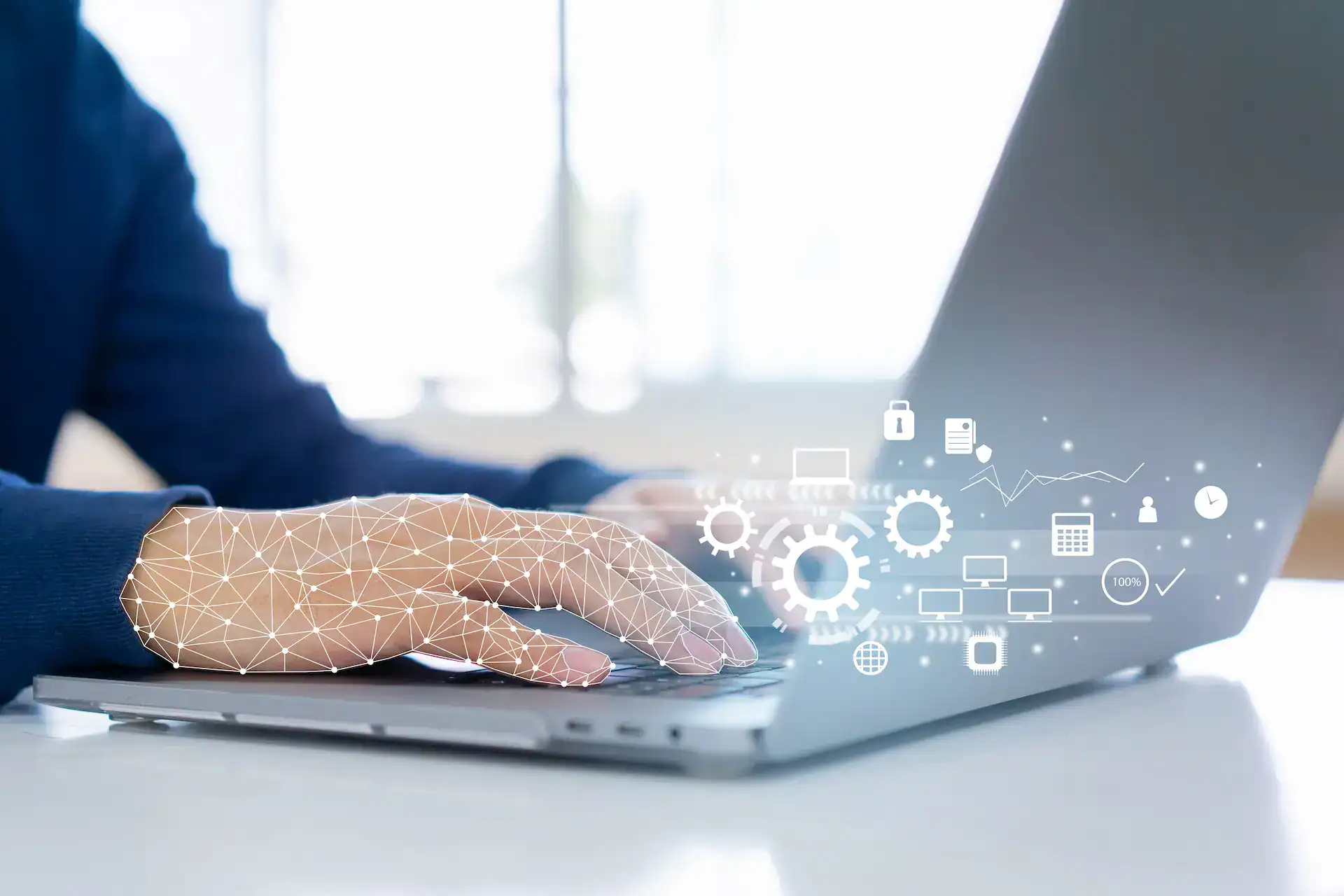 A man types on his laptop, engaging with AI tools to support his work and career development.