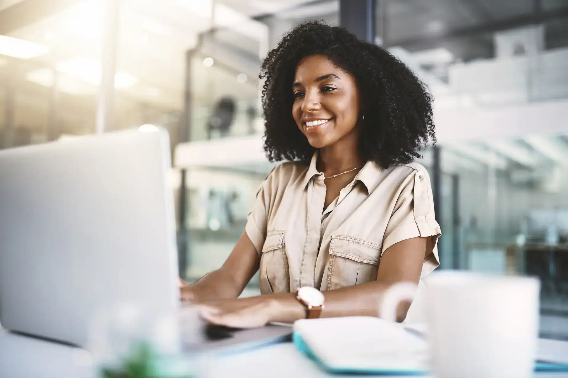 A woman typing on her laptop while getting started on LinkedIn.