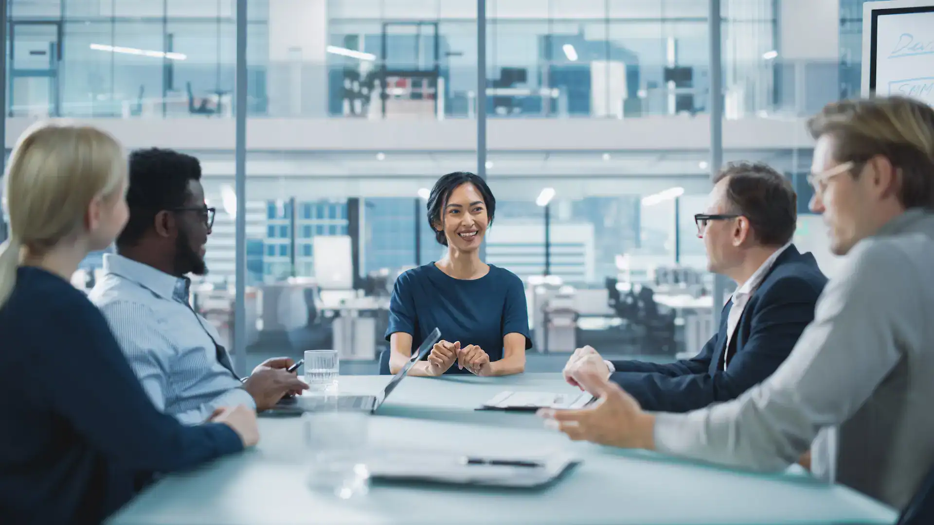 A meeting where the manager listens attentively, showcasing a skill inherent to Quiet Leadership.