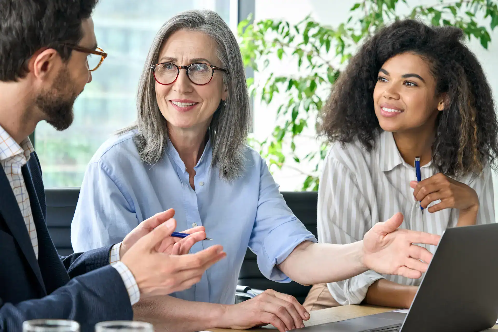 A meeting where the manager guides the team with care and empathy, showcasing a skill inherent to Quiet Leadership.