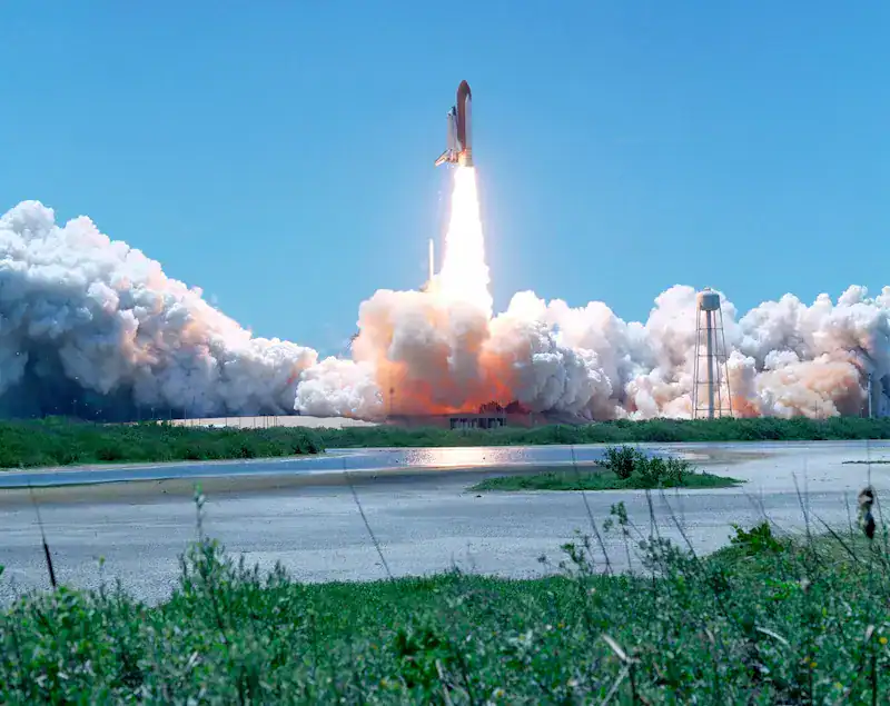A rocket launching into a clear blue sky, symbolizing the official launch of the new PathWise career growth community on Circle.