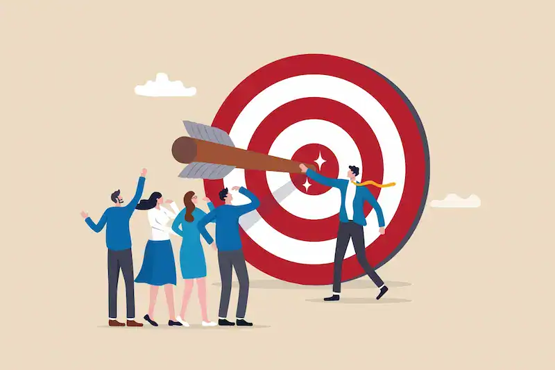 Illustration of people working together to aim an arrow at a bullseye, symbolizing focused goal setting.