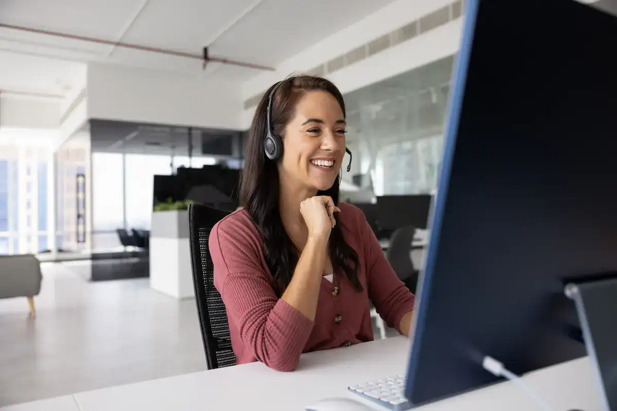 Executive coach providing one-on-one virtual coaching during an online meeting.