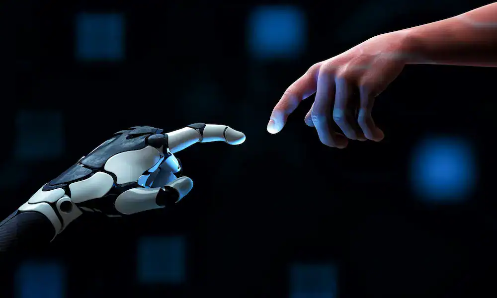 Human hand reaching toward a robotic hand, representing the uniquely human skills that will shape careers in the age of AI.